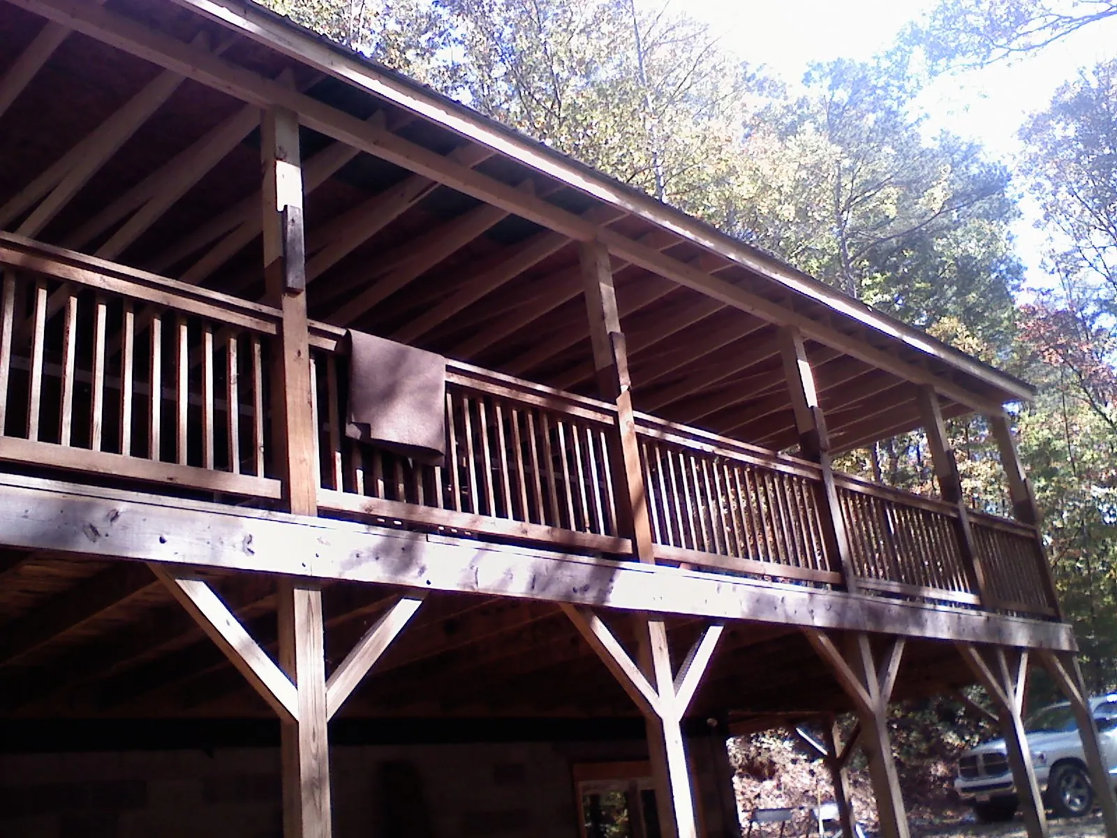 Timber framing under a new elevated porch and deck — Roof Leak Repair in Six Lakes by Roofing Brothers